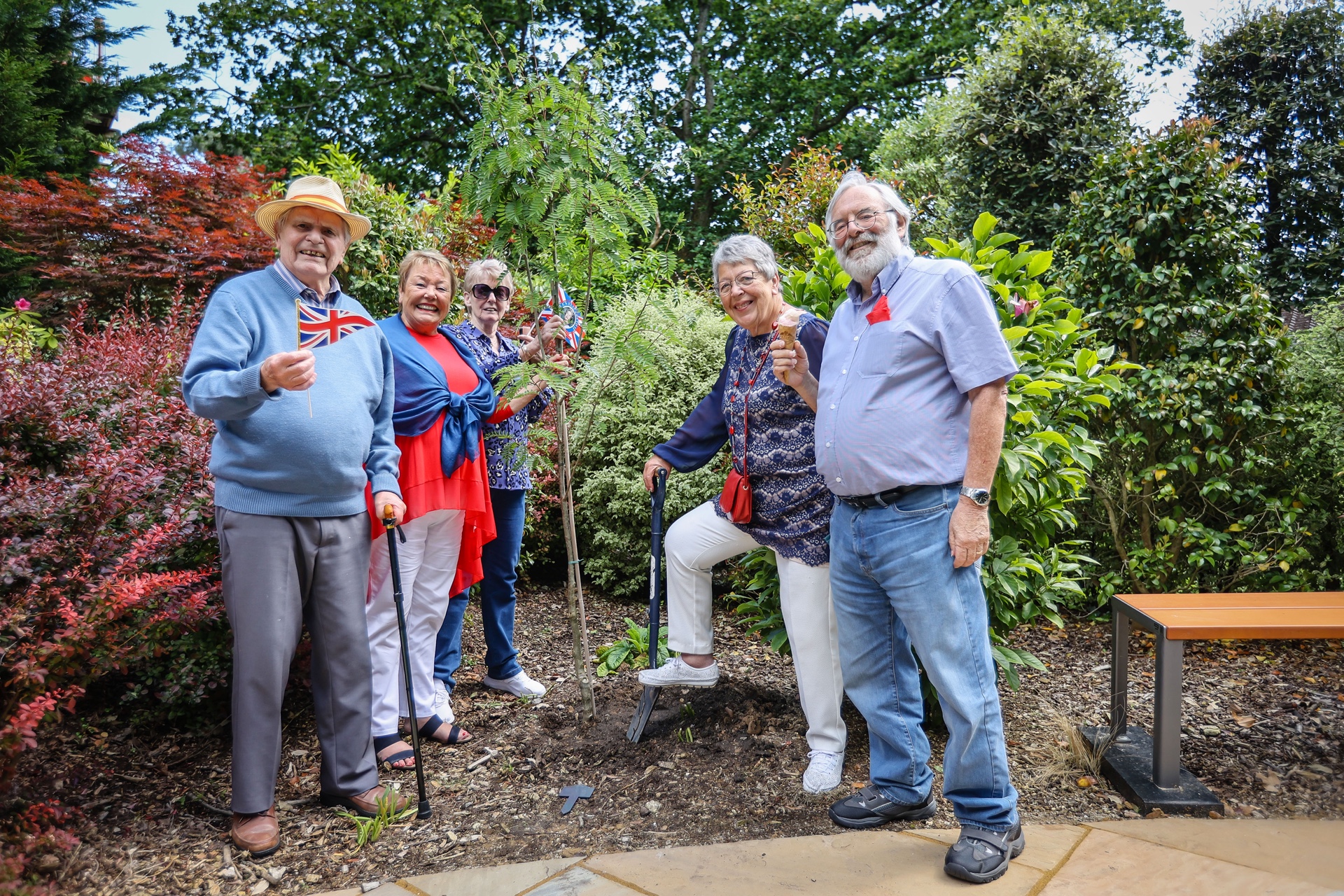 homeowners planting a tree for the queens green canopy
