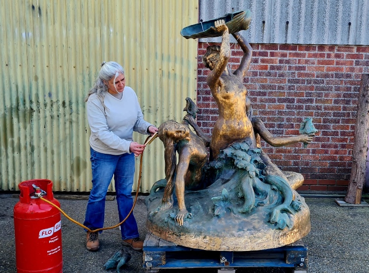 Jayne Meadows pictured working on the Finch House fountain statue