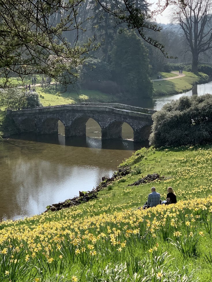 picture of a bridge crossing a river on a sunny day in the countryside