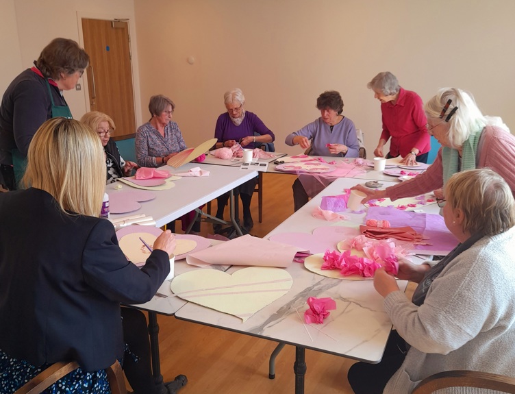 Group of seniors at Platinum Skies Chapters crafting